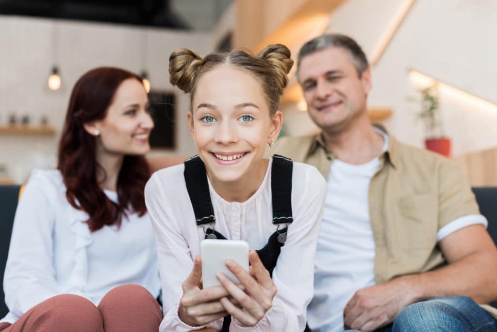 smiling parents with daughter