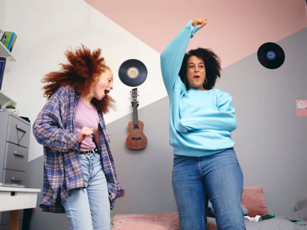 mom and daughter singing and dancing