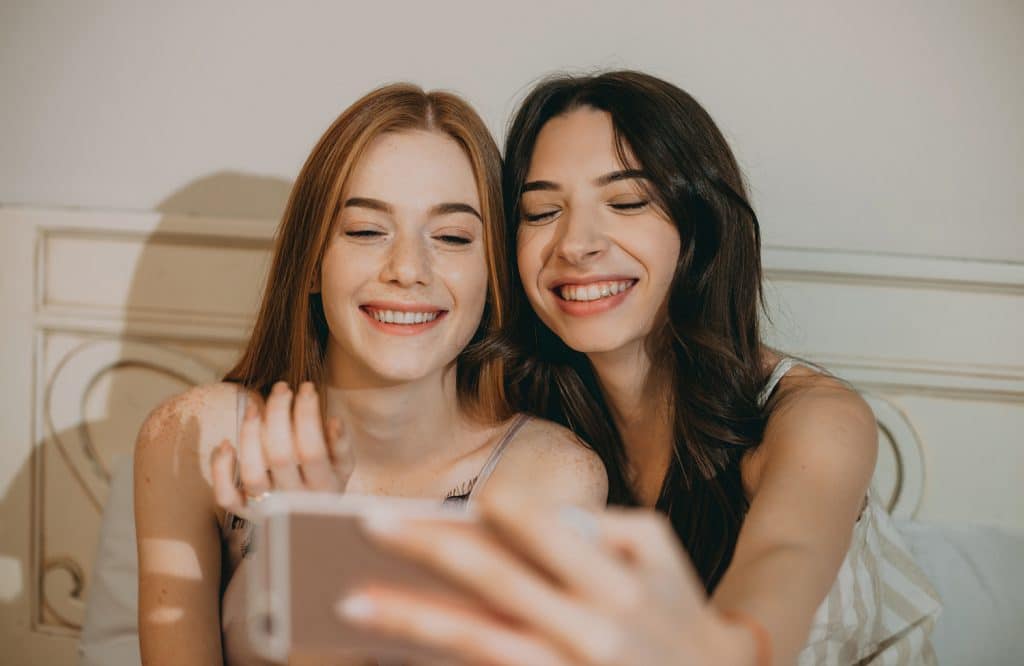 teen girls taking a selfie