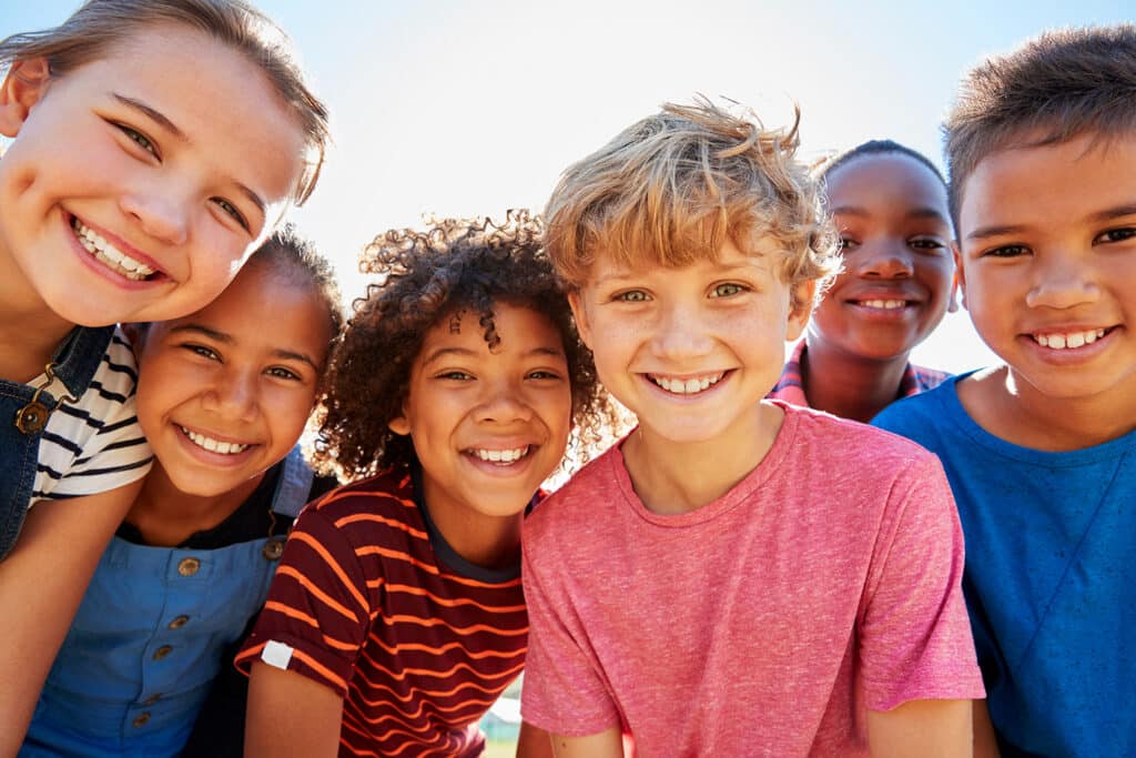 group of young kids smiling at camera