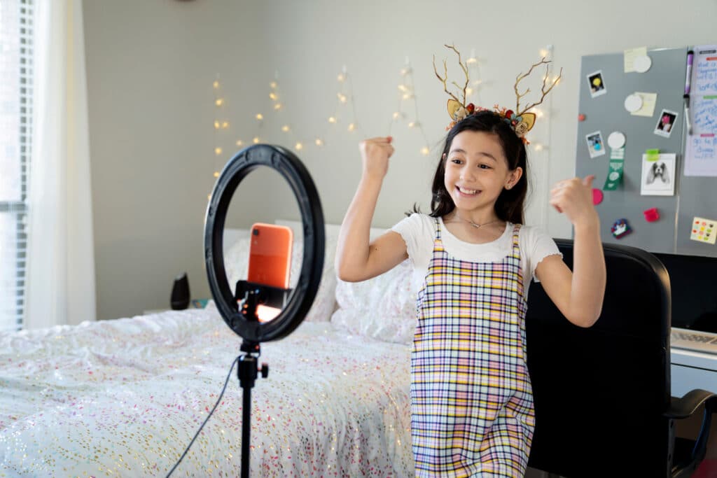 tween girl filming tiktok