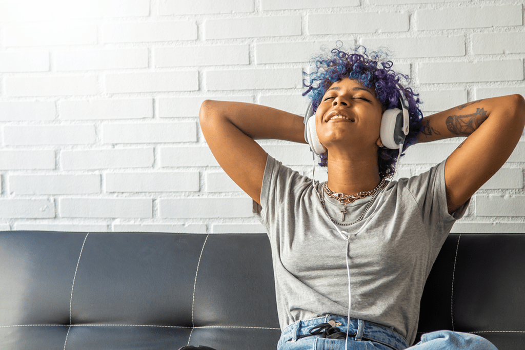 teen girl happy listening to music headphones