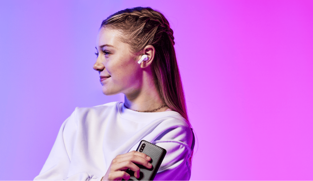 smiling girl with gabb phone and gabb headphones